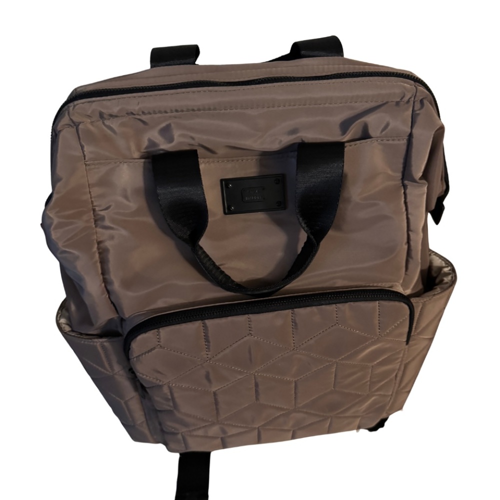 Steve Madden quilted backpack tote in a taupe/brown shade with black straps